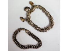 A silver link bracelet twinned with a heavy gauge