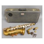 A brass Bundy Alto saxophone with case