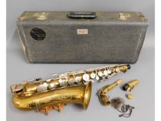 A brass Bundy Alto saxophone with case