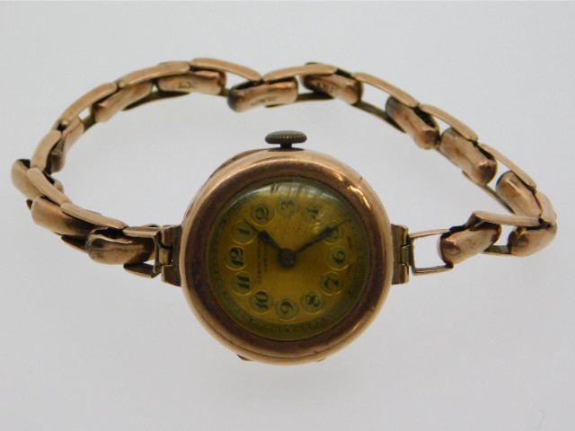 A 9ct gold wrist watch by James Walker, London, runs when wound, case diameter 22mm, 19.9g