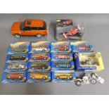 A quantity of diecast vehicles & a larger unboxed