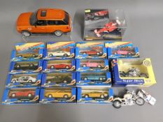 A quantity of diecast vehicles & a larger unboxed