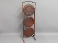 An Edwardian three tier mahogany cake stand, 34in