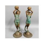 A pair of French Sun & Moon spelter candle holders
