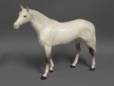 A large Beswick grey horse, 11in tall