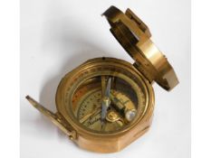 A brass Stanley of London compass with wooden stor