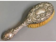 A silver backed brush, faults to silver