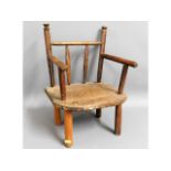 A rustic child's chair with elm seat, some worm 19