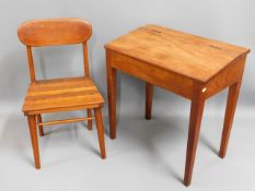 A teak child's school desk & chair