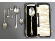 A cased silver christening spoon twinned with othe