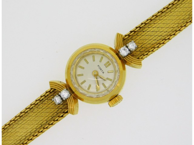 A ladies 18ct gold Porta wrist watch set with four diamonds of approx. 0.16ct, 6.25in long, 23.7g, n