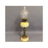 A Victorian oil lamp with ceramic & brass stand &