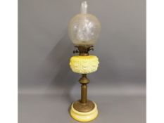 A Victorian oil lamp with ceramic & brass stand &