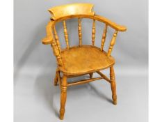 An antique elm smokers bow chair, 32in high