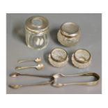 Two silver rimmed glass salts, two silver sugar to