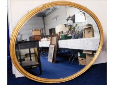 A very large 19thC. gesso framed oval mirror, 64in