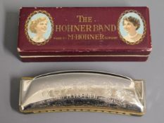 A boxed Hohner mouth organ