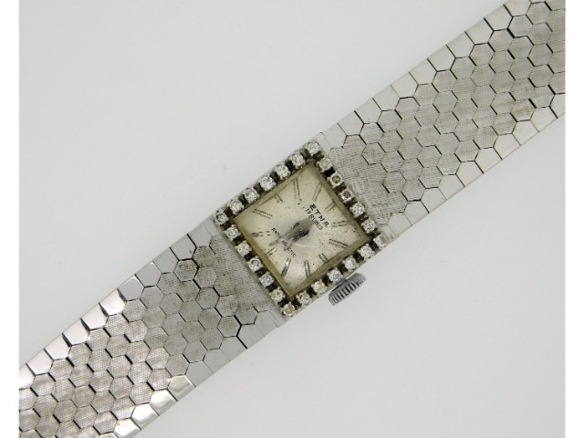 A ladies 18ct white gold Etna wrist watch set with twenty four diamonds of approx. 0.24ct, 6in long,