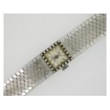 A ladies 18ct white gold Etna wrist watch set with twenty four diamonds of approx. 0.24ct, 6in long,