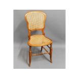 An antique cane seated bedroom chair, 33in high