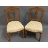 A pair of walnut Edwardian upholstered chairs, 33i