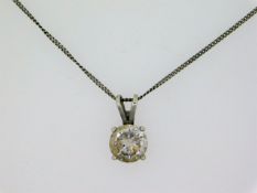 An 18in silver chain set with white stone pendant,