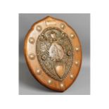 An oak mounted copper shield, "Best All Round Plat