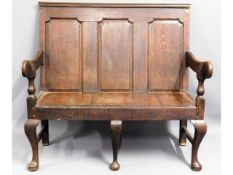 An antique oak settle with cushion, 43.5in wide x