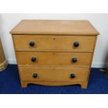 A low level 19thC. three drawer pine chest, 33.5in wide x 29in high x 18.5in deep