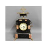 A Victorian slate & marble mantle clock with ornat