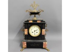 A Victorian slate & marble mantle clock with ornat