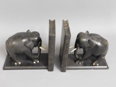 A pair of substantial hardwood elephant bookends,