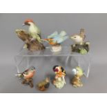 A quantity of porcelain bird models including Besw