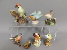 A quantity of porcelain bird models including Besw