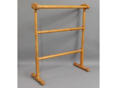 An early 20thC. towel rail, 32.75in high