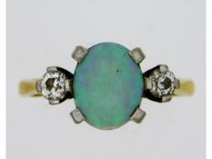 An 18ct gold opal ring set with 0.2ct diamonds, 3.54g, size L