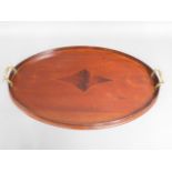A two handled Edwardian mahogany tray with gallery