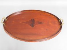 A two handled Edwardian mahogany tray with gallery