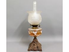 A c.1900 oil lamp with cast base & enamelled glass