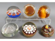 Six glass paperweights including millefiori