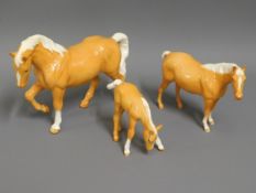Three Beswick palomino horses, tallest 6in