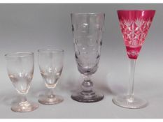 A tall Georgian glass, two 19thC. wine glasses & a