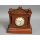 A wooden electric clock, 10.75in high