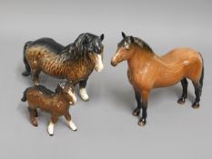 Two Beswick Shetland ponies twinned with a Doulton