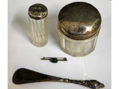 A silver topped tidy, one other, a silver handled