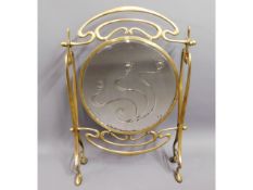 An art nouveau brass firescreen with mirror, 39.5i