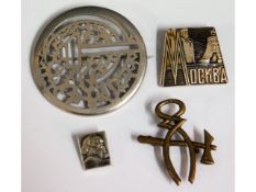 A Russian white metal brooch & three other Russian