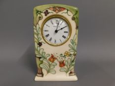 A Moorcroft pottery clock with box, 6.15in tall