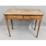 A mahogany two drawer hall table with brass fittin
