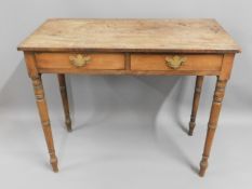 A mahogany two drawer hall table with brass fittin